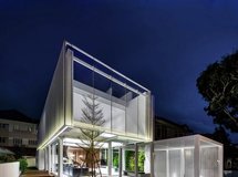 A House Designed As A Floating Box Above A Glass Living Space